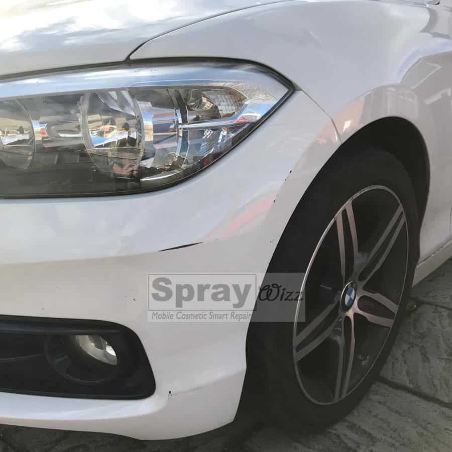 BMW bumper with visible scuffs before repair